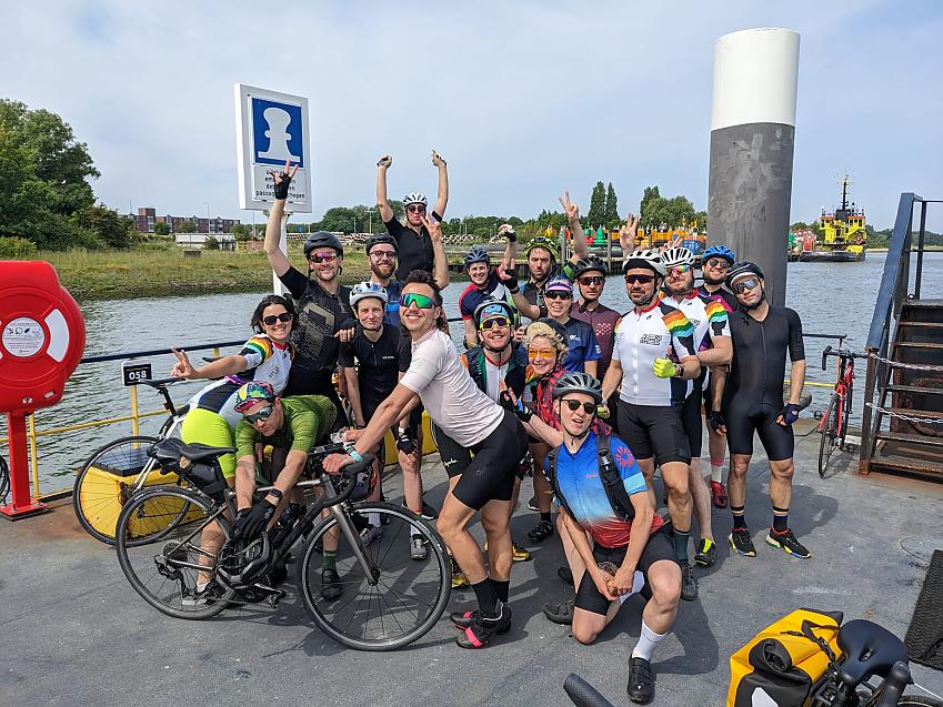 A group of cyclists posing on a ferry