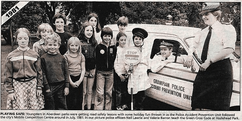 A newspaper clipping from 1981 showing school children and two police officers, promoting road safety