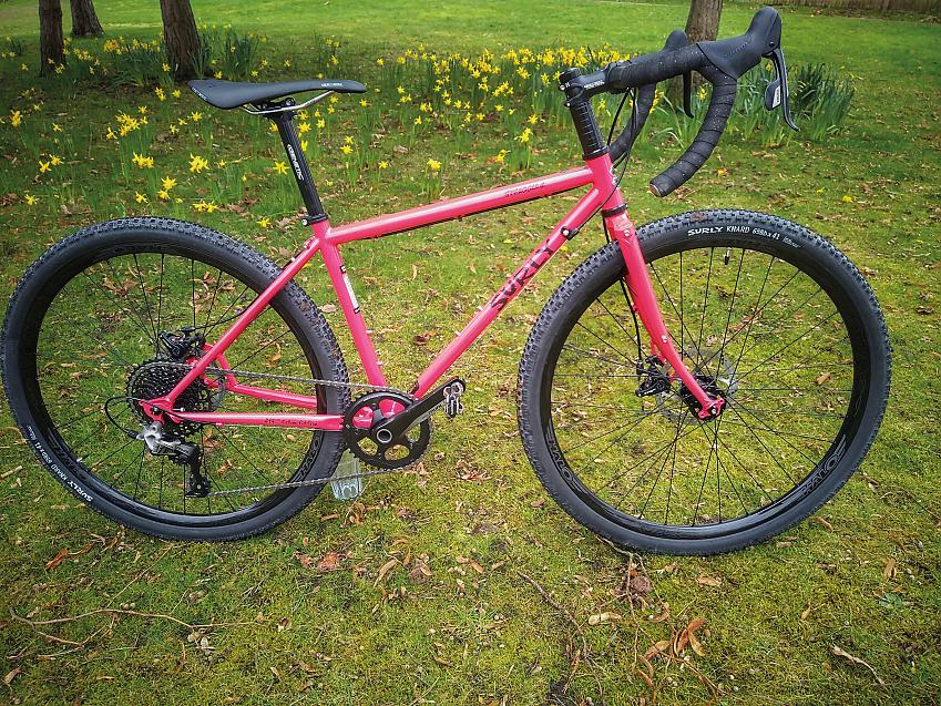 A pink Surly gravel bike