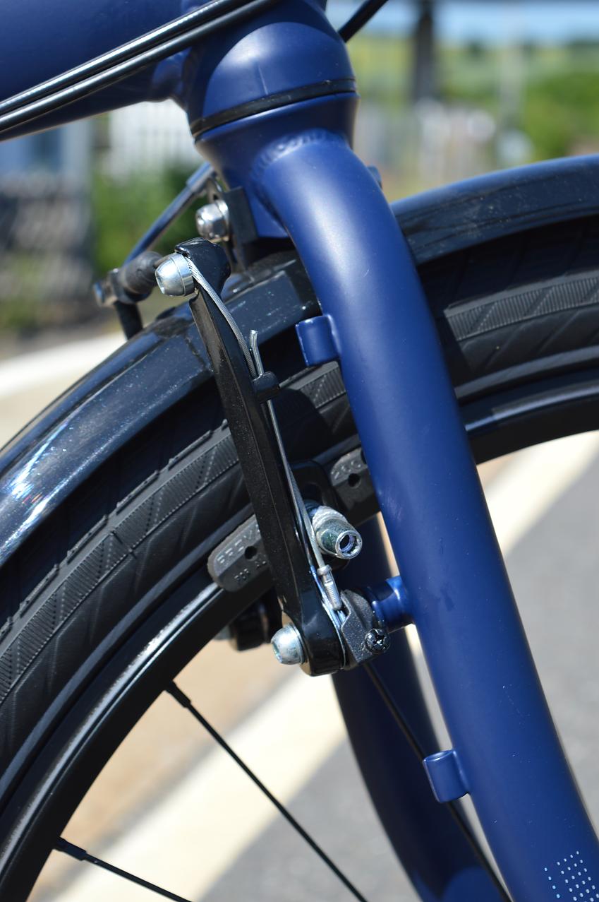 A close-up of the Tern's front fork and brakes, showing how the brakes are behind the fork rather than in front
