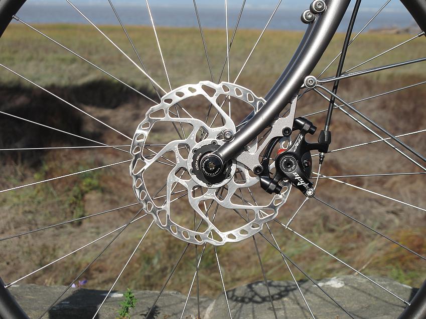 A close-up showing the Thorn's disc brakes and front fork