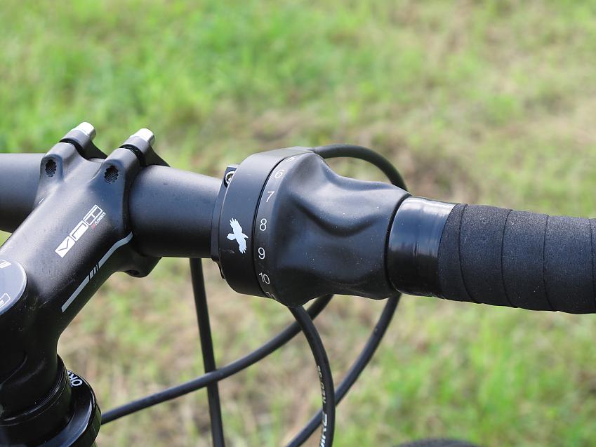 A close-up of the Thorn's shifter on the handlebar next to the stem