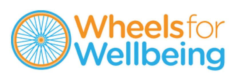 Wheels for Wellbeing logo. An orange and blue bicycle wheel sits next to the words Wheels for wellbeing, also coloured in orange and blue