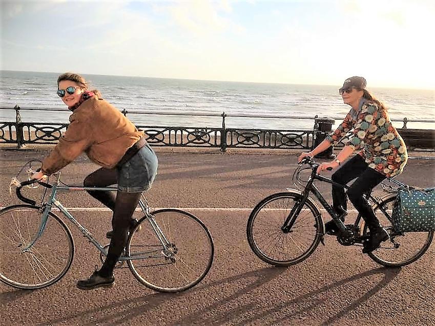 Julie and her daughter cycling together in Brighton 