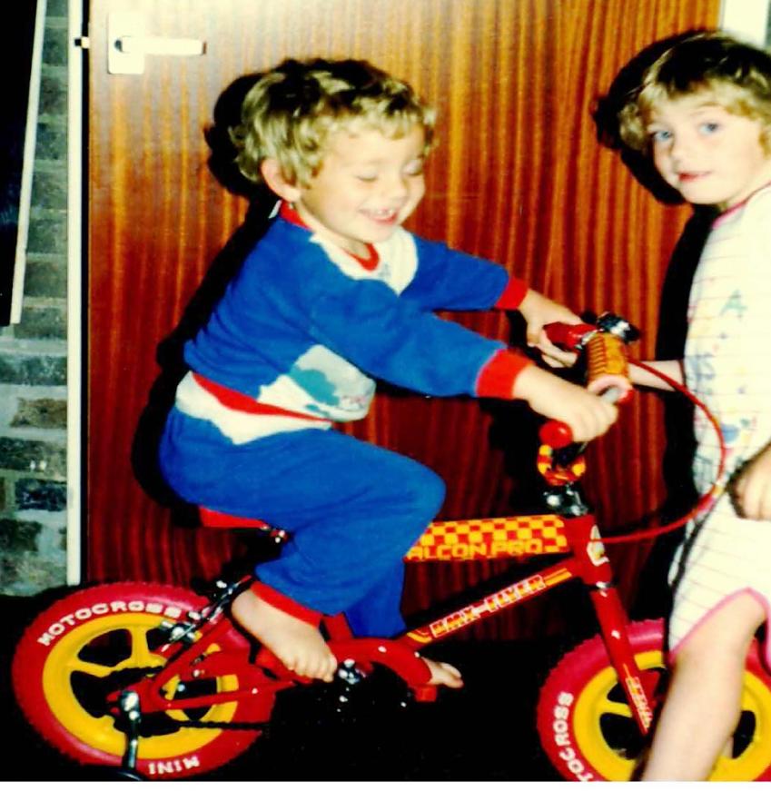 Two children with new bike for Christmas