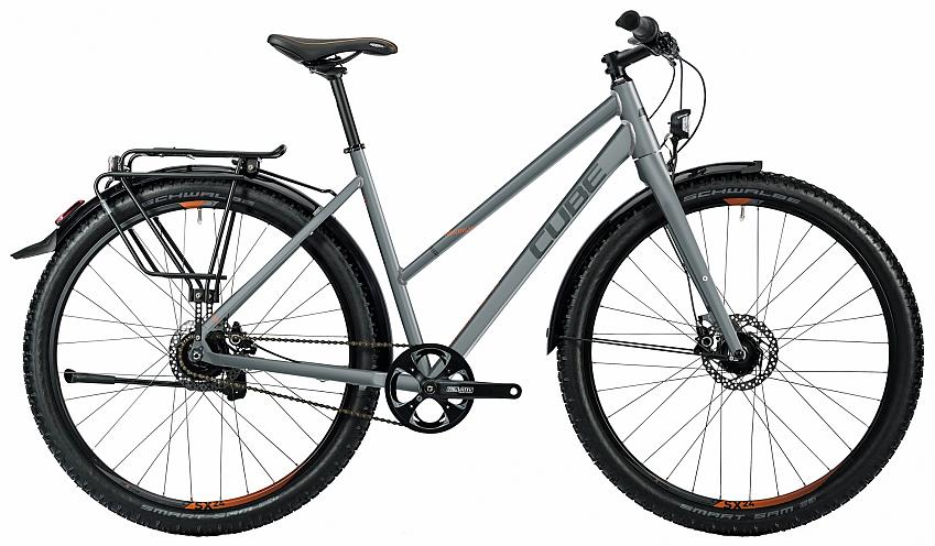 The Cube Travel Pro, a grey hybrid bike with flat handlebar, rear rack and fat tyres