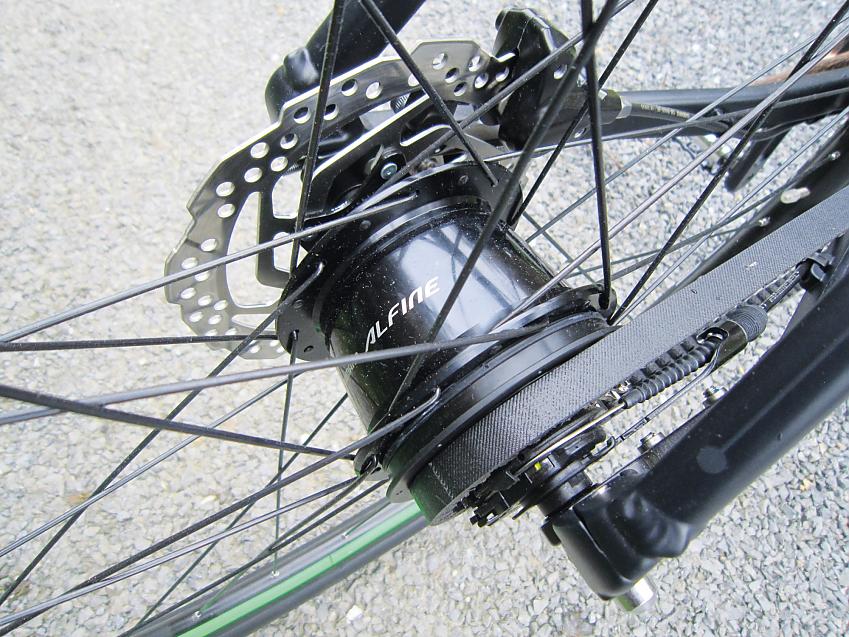 A close-up of a bike's back wheel showing the hub