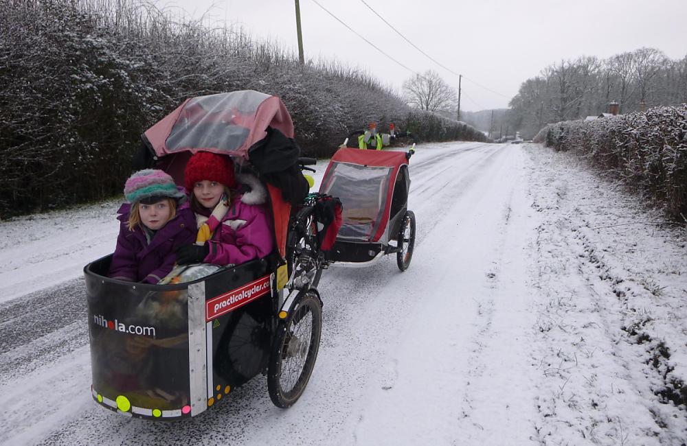 Josie Dew cycling to school in the snow