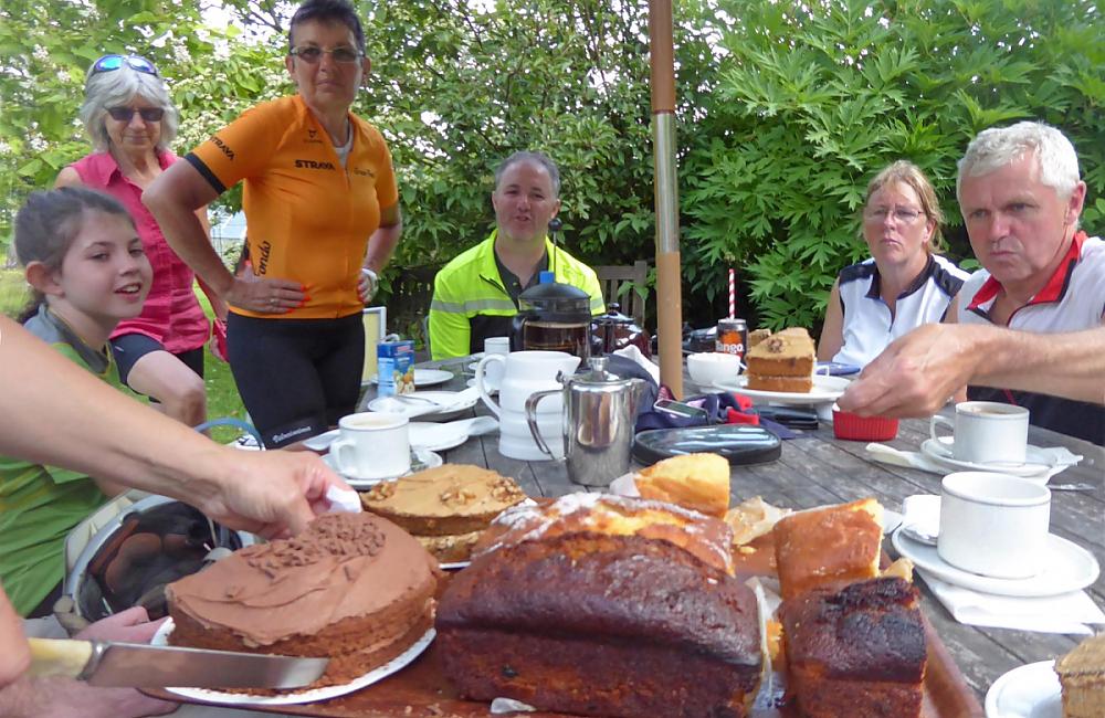 Cyclists eating cake at Annie's