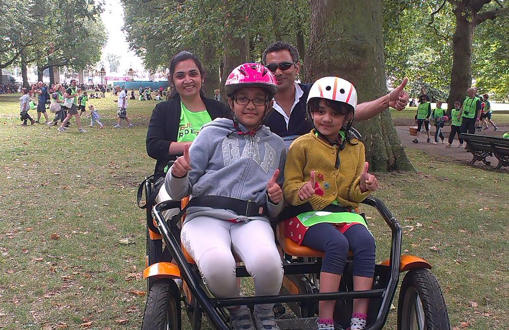 Two children enjoying the inclusive cycling at Green Park